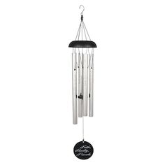 a wind chime hanging from the side of a white wall