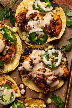 chicken fajitas on corn tortillas with jalapenos and sour cream sauce