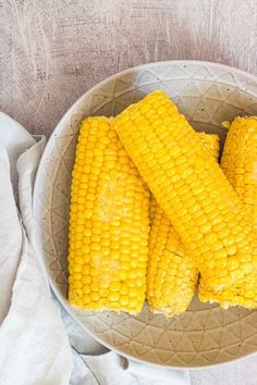 corn on the cob in a white bowl