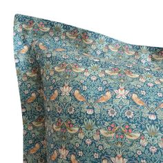 an image of a blue and pink floral print pillow case on a white background,