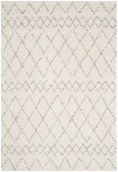 a white rug with an abstract design on it