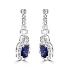 Juleve 18 Karat White Gold Halo Drop Earrings Featuring 9.88 Carat Total Weight Cushion Cut Sapphire Accented By 2.31 Carat Total Weight Baguette and Round Brilliant Diamonds. Blue Tanzanite, Gold Halo, Diamond Drops, Diamond Drop Earrings, Brilliant Diamond, Cushion Cut, Round Brilliant, Gold Diamond, Halo