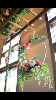 flowers are hanging from the ceiling in a room