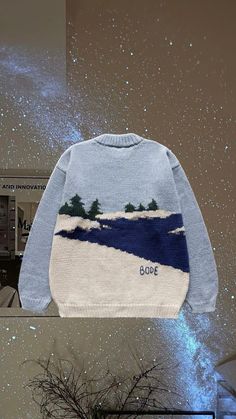 an image of a sweater with trees on it