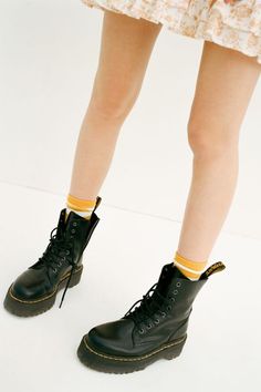 An icon reimagined with fiercely punk-inspired details in this platform iteration of Dr. Martens' classic 8-eye combat boot. Smooth leather boot cut above ankle with an 8-eye lace-up closure and back pull tab. With their air-cushioned sole with top-stitch detailing complete with cotton laces, metal eyelets and a slightly raised heel. Finished with their signature slip-resistant rubber sole in a towering platform with iconic yellow stitching.Content + Care. Leather, rubber Spot clean Imported Siz Dr Martens Jadon, Punk Inspiration, Reebok Club C, Trending Boots, Retro Sneakers, Doc Martens, Dr. Martens Boots, Chucks Converse, Shoe Sale