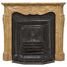 an old fashioned fireplace is shown in black and gold marble with intricate carvings on the mantle