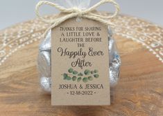 a wedding favors tag on top of a wooden table