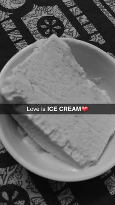 two pieces of ice cream on a plate with the words love is ice cream over it