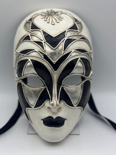 venetian mask full face. Gala mask of a woman face mask, decorated in white, silver and black. This is an intriguing mask with such an expressionless face that it makes you wonder who or what is behind this mask. This face mask would be an intriguing object as wall art, but can most definitely be used for a theater mask, gala mask, masquerade mask.  The mask has straps for wearing. Also a very special Halloween mask. Masquerade Mask Full Face, Expressionless Face, Masquarade Mask, Theater Mask, Mask Full Face, Venetian Masquerade Masks, Venice Mask, Theatre Masks, Black And White Face