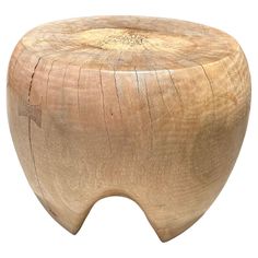 a small wooden stool made out of wood