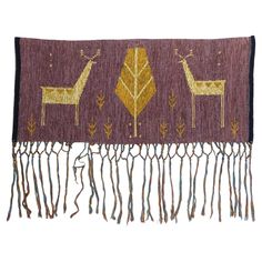 a purple and gold scarf with two deers on it