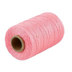 a spool of pink thread on a white background