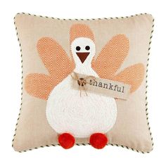 a decorative pillow with a turkey on it