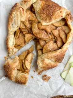 an apple pie is cut into pieces and ready to be eaten