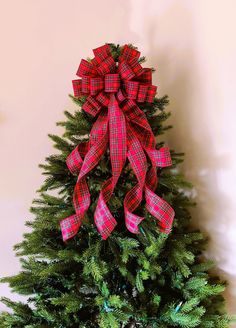 Customizable hand-crafted classic Christmas bow. Use on wreaths, mantels, gifts, tree toppers, etc. Three ribbon colors to choose from: tartan, traditional plaid and linen (the linen is a light brown fabric, similar to the burlap look). Photo examples of each color are in the photo section of the listing. Made with wired ribbon. Secured with a chenille stem, which is also used to attach your bow to your tree (or other decor).  Choose from the following sizes: 12" bow with six streamers, the long Christmas Bow For Wreath, Bow Christmas Tree Topper, Bow For Wreath, Bow Christmas Tree, Christmas Tree Topper Bow, Tree Topper Bow, Tartan Christmas, Bow Christmas, Christmas Tree Topper