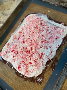 a homemade peppermint barkle cake on a baking sheet ready to go into the oven