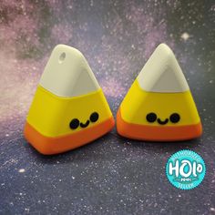 two yellow and white plastic cones with eyes