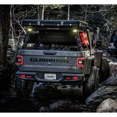 the back end of a jeep with its lights on