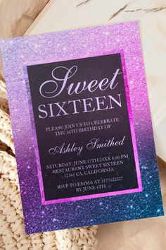 a purple and blue glitter sweet sixteen birthday party card on top of a wicker basket