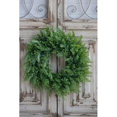 a wreath is hanging on the front door