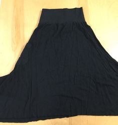 "This fun, A-line skirt is made from our medium weight 55%hemp/45%organic cotton jersey, is so comfortable and flattering with it's non-linear hemline, and shapely side patch pocket. It's wide 53% hemp/43% organic cotton/45% spandex stretch jersey waistband is designed to hug and support the low rise waistline (works well as a maternity skirt). The Forest skirt's hemline has a fun, raw edge for it's natural curly flow. This skirt gives you that comfortable everyday wear quality. Available in S-X Casual Solid A-line Maxi Skirt, Casual A-line Maxi Skirt With Elastic Waistband, Spring Casual Maxi Skirt With Wide Hem, Casual Wide Hem Maxi Skirt For Spring, Baggy Cotton Casual Skirt, Casual Baggy Cotton Skirt, Solid Color Cotton Stretch Maxi Skirt, Cotton Maxi Skirt With Relaxed Fit And Lining, Casual Maxi Skirt With Elastic Waistband For Loungewear