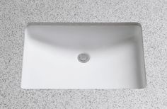 a white sink sitting on top of a counter