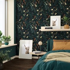 a bed room with a neatly made bed next to a window and plants on the wall