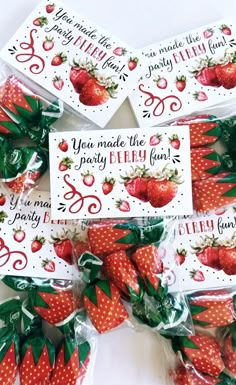 strawberries are wrapped in cellophane and placed on top of each other to be used for party favors