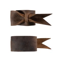 two pieces of leather with bows on each side and one piece in the middle, both brown