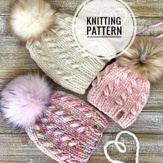 three knitted hats with pom - poms