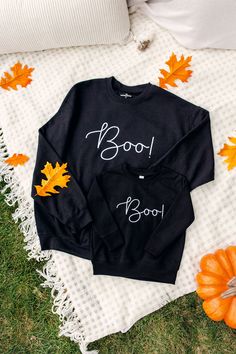 Boo! This crewneck sweatshirt is SCARY cute! Wear this sweatshirt everywhere! This festive sweatshirt calls for a cute pair of leggings or your favorite jeans! Dress up with boots, or dress down with tennis shoes! This black sweatshirt is embroidered with white thread. Order from sizes 2T to 5XL. It is unisex sized. This means the sizing is boxy, not fitted like women's, but it is not oversized. It is true to size. This design and colors cannot be altered, resized, or changed. Toddler Specificat Cute Black Sweater For Fall, Cute Black Fall Sweater, Cute Black Crew Neck Sweater, Halloween Long Sleeve Loungewear Sweatshirt, Cute Fall Letter Print Sweatshirt, Cute Letter Print Sweatshirt For Fall, Cute Black Sweatshirt For Fall, Cute Black Fall Sweatshirt, Cute Black Sweatshirt With Letter Print