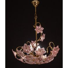 a chandelier with pink flowers hanging from it