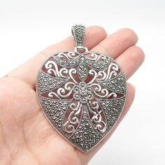 Great vintage condition.  925 Sterling Silver Vintage Real Marcasite Gemstone Heart Ornate Pendant  Weight: 28.2g   WELCOME TO PAWN SHOP We are an actual pawn shop and have been in business for over 25 years. Since 1990, our establishment has been serving a variety of clients by providing them with short term cash solutions and options of liquidity regarding their treasured heirlooms. Acknowledging that today′s customers are very sophisticated and are looking for a variety of investments, our ac Heart Gemstone, Pawn Shop, 25 Years, Jewelry Necklace Pendant, Vintage Jewelry, Jewelry Necklaces, 925 Sterling Silver, Pendant Necklace, Sterling Silver