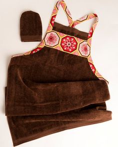 a towel, hat and apron are laid out on the table to be used for cooking