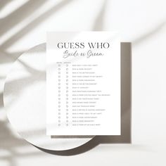 the guess who guide is on top of a white plate with shadow from it's shadow