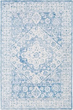 a blue and white rug with an intricate design