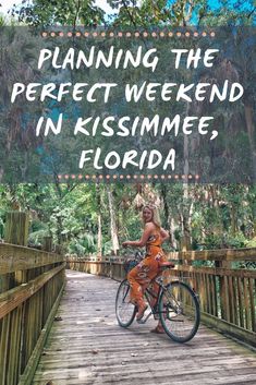 a woman riding a bike across a bridge with the words planning the perfect weekend in kissimme, florida