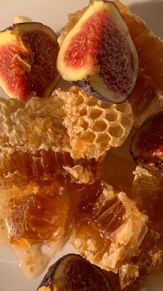 sliced figs and honey on a white plate