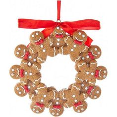 a gingerbread wreath ornament hanging from a red ribbon on a white background