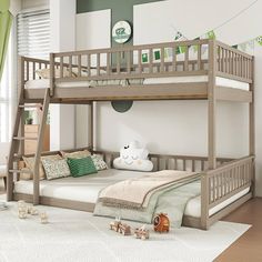 there is a bunk bed with a ladder on the bottom and green curtains above it