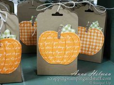 small bags with pumpkins and gingham tags on them