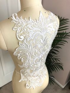 Unique LIGHT IVORY Sequin Lace Applique, Made with RAYON. Perfect for bringing BEAUTY to your Wedding Gowns, Bridal Veils, Lace Garters, Ballet, Elegant Dresses, or other Costume Designs! **NOTE: We have 2 pieces left of this lace and it is on clearance for 50% off, due to a tiny blemish on each of them. Quantity: for 1 piece Size: about 38.5" X 14.5" (96cm X 36cm) Shipping: USPS first class. Message for details if rush order is needed. BRIDAL LACE APPLIQUES:  https://www.etsy.com/shop/LaceLoveL Lace Garter, Unique Lighting, Bridal Veil, Lace Applique, Bridal Lace, Elegant Dresses, Veil, Lace Trim, Diy Wedding