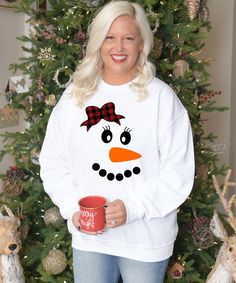 The Christmas season is almost here! Buffalo Plaid and Christmas go hand in hand. Born To Be Sassy offers this design in a variety of styles. Pair with jeans or leggings. Be the sassiest lady in this buffalo plaid snowman tee this Christmas! White Winter Holiday T-shirt, Fun Winter T-shirt With Crew Neck, Funny White Winter T-shirt, Fun White T-shirt For Holiday, Cute Winter Tops As Gift, Funny White T-shirt For Winter, Cute Winter Tops As A Gift, Fun Winter Crew Neck T-shirt, Fun Crew Neck T-shirt For Winter