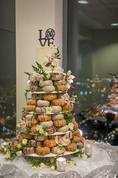 a wedding cake made out of doughnuts and flowers