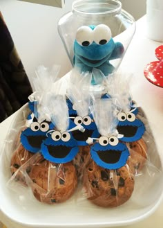 cookie cookies with blue eyes and googly eyes in plastic bags on a white plate