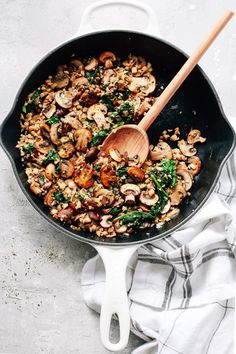 overhead view of a white skillet contains Mushroom Cauliflower Rice Mushroom Cauliflower Rice, Cauliflower Rice Skillet, Rice Skillet, Asparagus Soup, Cauliflower Rice, Skillet, Asparagus, Spinach, Rice