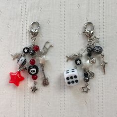 two key chains with charms attached to them