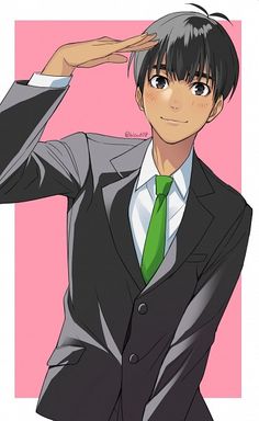 a man in a suit and tie is holding his hand up to his head while wearing a green tie