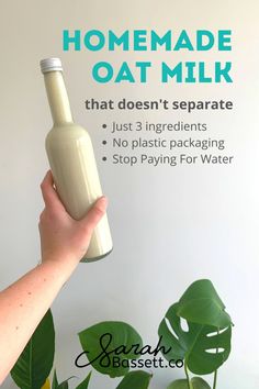 a hand holding a bottle that says homemade oat milk