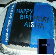 a blue and black birthday cake with the words happy birthday aisha on it's side